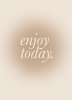 the words enjoy today written in white on a beige background