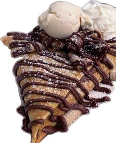 two scoops of ice cream and chocolate crepes on top of each other