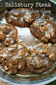 mushrooms in mushroom gravy cooking in a skillet with the words salisbury steak in it