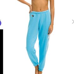 Brand New Never Worn Light Blue Sporty Loungewear Pants, Sporty Light Blue Loungewear Pants, Sporty Light Blue Pants For Loungewear, Sporty High Rise Lounge Bottoms, Casual High Waist Blue Sweatpants, Casual High-waist Blue Sweatpants, Blue Sporty Tapered Leg Bottoms, Sporty Blue Tapered Leg Bottoms, Light Blue Athleisure Bottoms For Loungewear