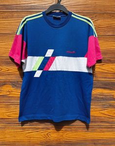 Adidas retro style T-shirt. Size fits M,L Retro Sports T-shirt With Graphic Print, Sporty Multicolor Color Block T-shirt, Sporty Pink T-shirt With Screen Print, Color Block Crew Neck T-shirt For Streetwear, Color Block T-shirt For Sports In Summer, Color Block T-shirt For Summer Sports, Retro Multicolor Screen Print T-shirt, White Retro Print T-shirt For Streetwear, 90s Inspired Blue T-shirt With Letter Print