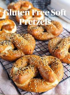 bagels on a cooling rack with the words gluten free soft pretzels