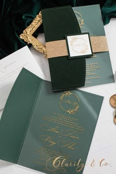 the wedding stationery is green and gold