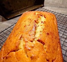 a loaf of bread sitting on top of a cooling rack