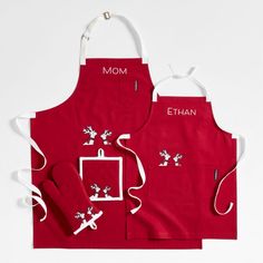 two aprons with the words mom and an image of a mouse on one side