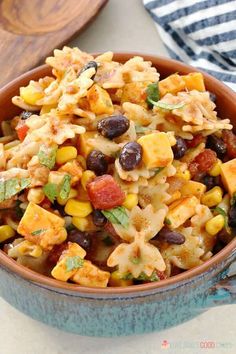 a bowl filled with pasta and black beans