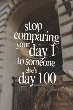 a woman standing in front of a building with the words stop comparing your day to someone else's day 100