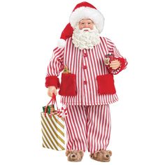 a santa clause is holding two bags and wearing red and white striped pajamas with his hands in his pockets