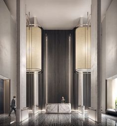 a lobby with marble floors and tall columns