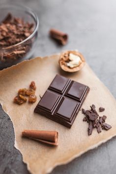 chocolate bars, nuts and other ingredients on a piece of parchment paper - stock photo - images