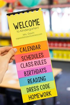 a person holding up a sign that says welcome to children