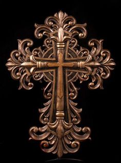 an ornate cross is shown against a black background