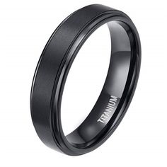 Unveiling a masterpiece of everlasting allure, the Classic Black Titanium Unisex Wedding Band from Evani Naomi Jewelry captures the essence of elegance. Crafted with the utmost care, this stunning symbol of commitment impresses with its flawless black finish, radiating a captivating sense of timelessness. Finely handcrafted to last a lifetime, our unwavering dedication to quality ensures that this band will be a cherished part of your love story forever. Its light weight grants unparalleled comf Titanium Engagement Rings, Black Titanium Ring, Ring Man, Timeless Ring, Titanium Wedding Band, Titanium Ring, Geometric Ring, Unisex Ring, Titanium Rings