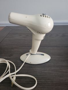 Vintage Hamilton Beach No 7 Quick Dry Hair Dryer on a Stand.  This stands 9 1/2 high and shows normal wear otherwise in excellent vintage condition and works great. International buyers, please convo me if you are interested in a shipping quote. Check shop announcements for any active sales and promo codes.  If you require insurance, please be sure to convo me. (This will add $2 to your shipping cost.) Please note that if you do not choose insurance, I can not be responsible for mail once it leaves my hands at the post office. Of course, I always provide delivery confirmation to anywhere in the US. Vintage Hair Dryer, Avon Lipstick, Disney Figures, Minnie Mouse Christmas, Hamilton Beach, A Stand, Vintage Girls, Vintage Hairstyles, Dry Hair