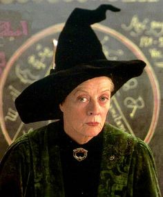 an older woman wearing a witches hat