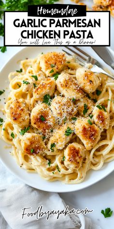 garlic parmesan chicken pasta is served on a white plate and garnished with parsley