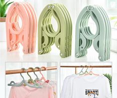 four different colored clothes hangers in various styles and sizes, with one hanging on a rail