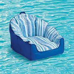 an inflatable chair floating in the middle of a pool filled with blue water