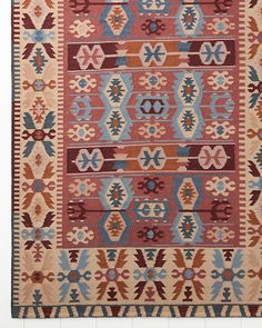 an old rug with many different colors and patterns