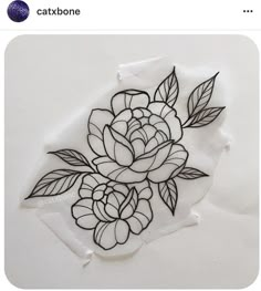 an image of a flower drawn on the side of a piece of paper with scissors