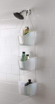 a shower head with three baskets hanging from it's side