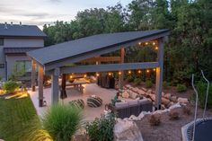 an outdoor patio with lights and seating area