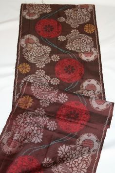 MEISEN silk Kimono Fabric - Bordeaux (Deep Brownish Red) This beautiful MEISEN kimono fabric, known for its unique craftsmanship, features a rich Bordeaux color that is close to deep brown. MEISEN refers to a traditional Japanese silk fabric, often woven with pre-dyed threads, giving the patterns a slightly blurred or soft look. MEISEN was highly popular during the early 20th century and remains beloved for its affordable yet elegant quality, making it a perfect choice for those seeking authentic Japanese textiles with a vintage touch. The fabric is lightweight and sheer, designed for summer wear, with a soft translucency that allows some visibility from behind. Material: Silk Condition: Very good  Age: Unknown Origin: Japan Width:36cm Length:148cm SHIPPING: Shipping with Japan Post regist Bordeaux Color, Kimono Vintage, Japanese Textiles, Japanese Silk, Kimono Fabric, Fabric Remnants, Vintage Kimono, Deep Brown, Silk Kimono