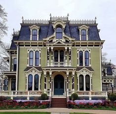 an old victorian style house with many windows