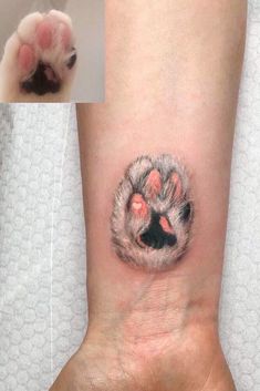 an animal paw tattoo on the wrist