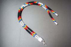 Add a touch of Native American style to your daily accessories with this white beaded lanyard. This bright and colorful badge or ID holder is perfect for adding a unique flair to your outfit. The adjustable length and breakaway function make it both stylish and practical. Stand out in the crowd with this beautiful handmade piece! S (13-14 inches) M (17-18 inches) L (21-22 inches) This product is made to order. I need 4-6 weeks after receiving the order to produce this item. Delivery from New Yor White Beaded Lanyard For Personal Use, Beaded Lanyard Native, Native American Beaded Lanyards, Pink Beaded Lanyards Native American, Adjustable White Lanyard With Key Leash, White Adjustable Lanyard With Key Leash, Rainbow Beaded Lanyard, Green Beaded Lanyards Native American, Adjustable White Lanyard