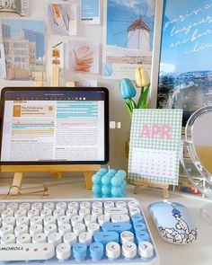 a desktop computer sitting on top of a desk next to a keyboard and mouse pad