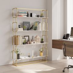 a white and gold shelving unit with bookshelves in an empty room next to a desk