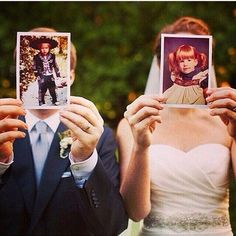 a man and woman holding up pictures in front of their faces to show them as if they were wedding photos