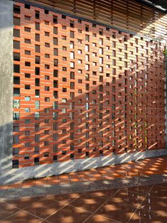 a red brick wall next to a building