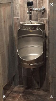 a urinal in the corner of a bathroom stall