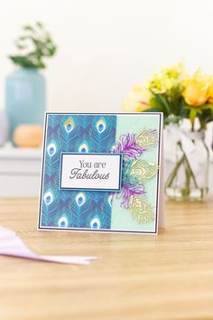 there is a card that says you are fabulous on the table next to some flowers