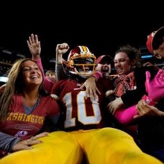 the football players are celebrating their team's win over american football team in a game