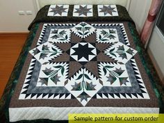 a bed with a quilt on top of it