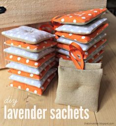 a pile of orange and white polka dot fabric sitting on top of a wooden table