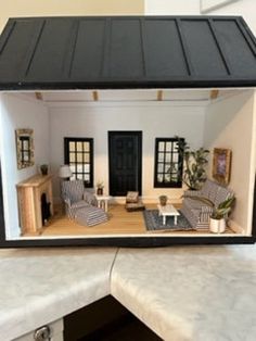 a doll house with furniture and accessories in it