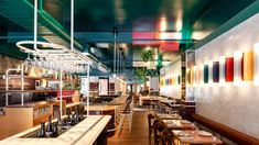 an empty restaurant with tables and chairs