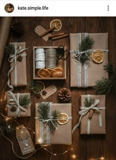 christmas presents wrapped in brown paper and tied with twine, pine cones, orange slices, cinnamon sticks, fir needles, silverware