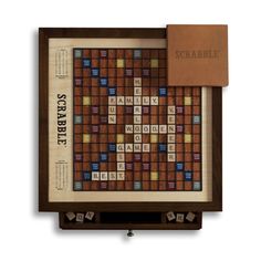 the scrabble board game in its wooden box