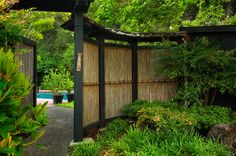 an outdoor area with trees and bushes surrounding it