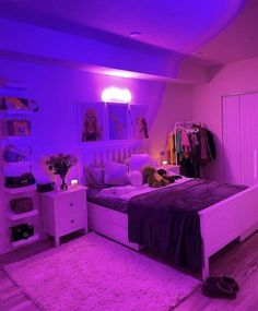 a bed room with a neatly made bed and purple lighting