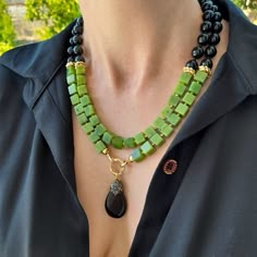 Canadian jade and black onyx layered necklace with pendant. Chunky statement natural gemstone beaded necklace for women. Large green black handmade necklace with big bead and gemstone. Big bold bohemian bright necklace in gold color are suitable for an casual look, evening look and for a holiday. These necklace will be a good Christmas, anniversary, wedding or birthday gift for women, mom, wife, girlfriend, sister or daughter. Women's necklace with natural stone. It emphasizes the beauty of your Green Onyx Necklaces Perfect As Gifts, Artisan Green Beaded Necklace With Large Beads, Green Onyx Necklace Perfect Gift, Green Onyx Necklace For Gifts, Green Onyx Necklace For Gift, Green Onyx Necklace Gift, Luxury Artisan Green Beaded Necklaces, Elegant Black Jade Jewelry, Black Jade Jewelry With Natural Stones