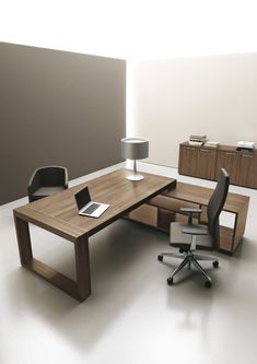 an office desk with two chairs and a laptop on it