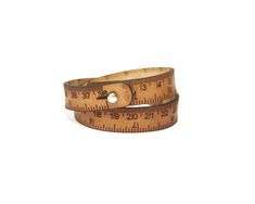 a measuring tape bracelet is shown on a white background