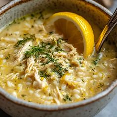 a close up of a bowl of food with a lemon