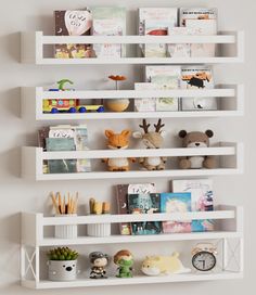 a white shelf filled with books and stuffed animals